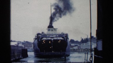 1960: a large boat that is moving towards land. MICHIGAN