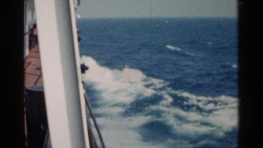 1960: a boat cutting through waves as seen from aboard the vessel MICHIGAN