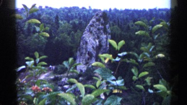 1960: interesting rock formation in forest MICHIGAN
