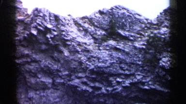 1960: the rock with a whole at a forest and it looks like a dry area