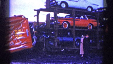 1961: a truck with cars being observed by people MINNESOTA