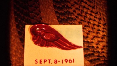 1961: wing pin "sept. 8 - 1961" and a fall city landscape. MINNESOTA