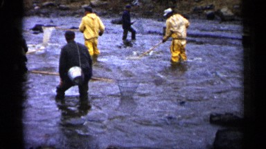 1961: the men are trying to catch fish on the river side MINNESOTA