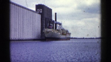 1961: a freighter being loaded at a factory MINNESOTA