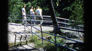 1961: three persons are talking each other and walking
