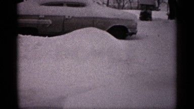 1961: the car parked at the outside the snow are fully covered