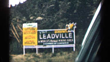 1963: road signs as seen traveling down the highway in a car COLORADO