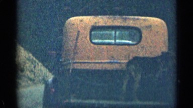 1963: the small load vehicle carrying animal tied in rope following another car
