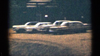 1963: a parking lot full of cars overlooking a hill COLORADO