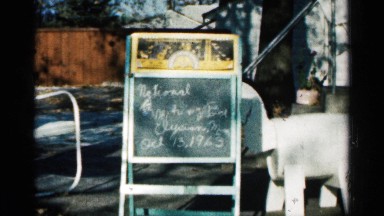 1963: folding sign depicting the date of a church meeting