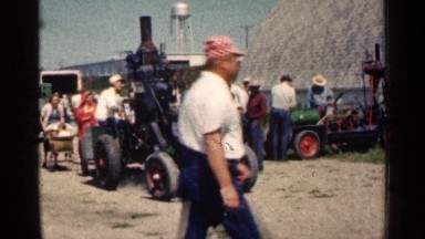 1963: smoke pours out of the engine of a makeshift antique tractor MONTGOMERY