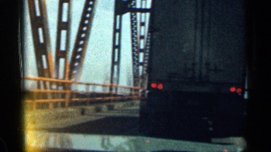 1963: sitting in traffic on a bridge and taking a look at the river below