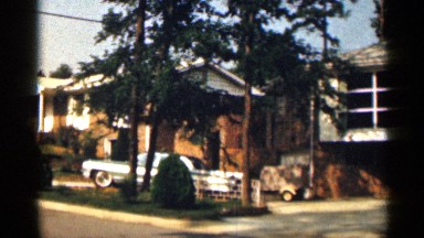 1963: the big building near parking car move the another place car back side