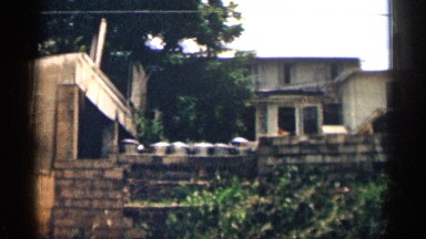 1963: Panning 8mm Footage of a Residential Alleyway in Texas