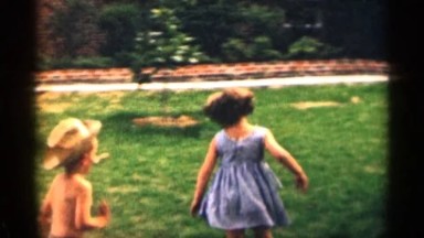 1963: three kids are chasing each other around their yard outside TEXAS