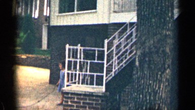 1963: Young Girl in Blue Swinging Jump Rope with Boys Playing Nearby