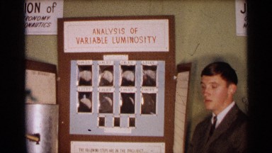 1963: Gentleman Presenting Science Project on Moon Luminosity Analysis