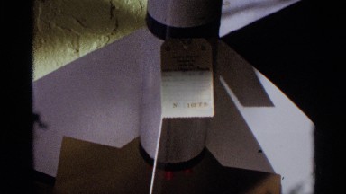 1963: Interior shows cement room with space vehicle model