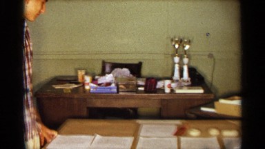 1963: a young boy seems to display his medals and certificate he got in a table