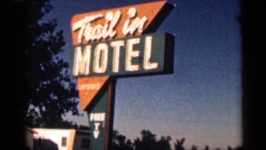 1963: sign of the motel where guest cars are parked. WYOMING COLORADO