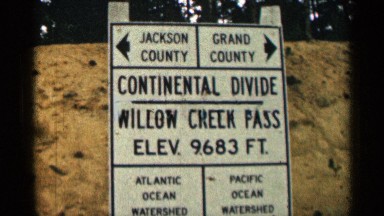 1963: two highways signs on state highway 125 in colorado WYOMING COLORADO