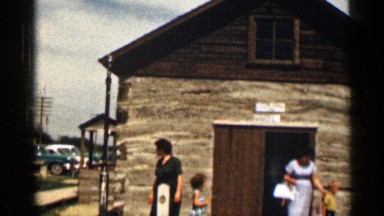 1963: people exiting and visiting a jail house. WYOMING COLORADO