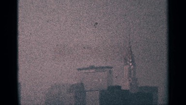 1964: many buildings are shown are here a single bird fly over the building