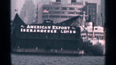 1964: cruising the harbor filming a ship in port of a major american city