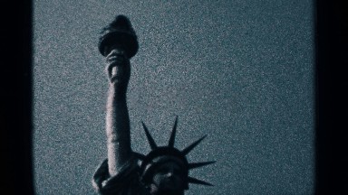 1964: statue of liberty torch being held up high straight into the sky