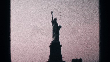 1964: liberty statue stands in the stone with crown seems to touch the sky