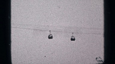 1964: two rope cars crossed each other in heights looks very beautiful