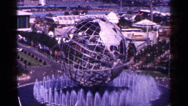 1964: a metal wire frame globe sits in the middle of a fountain. NEW YORK CITY