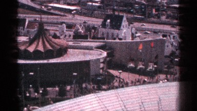 1964: the big round shape building to near white color building near road go to