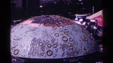 1964: purplish semicircle has different size rings and lines on its surface