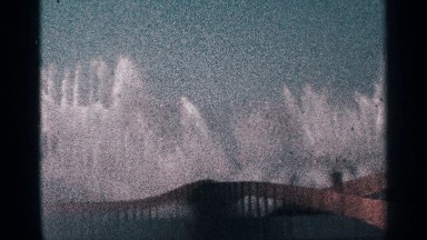 1964: The Big Fountain in Building with Water Spraying Near Brown Wall