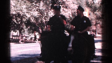 1964: two police officers have a conversation as they ride horses NEW YORK CITY