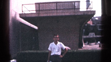 1964: small posing in front if short tower. NEW YORK CITY