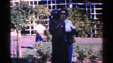 1964: two friends are meeting in the garden and sharing their happiness NEW YORK