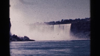 1964: A Large Waterfall Dumping Water Into a Large River Niagra Falls Canada