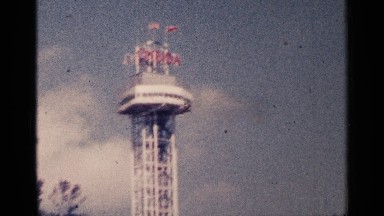 1964: A Big Tower with a Huge Flag Flying in Low Angle View