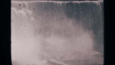 1964: Running Waterfall with Steam Rising at Niagara Falls Canada