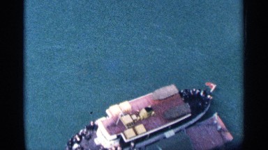 1964: the boat ride in the sea and the man is so happy to ride