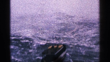 1964: a medium sized boat rocks too and grow in the rough, choppy sea NIAGRA