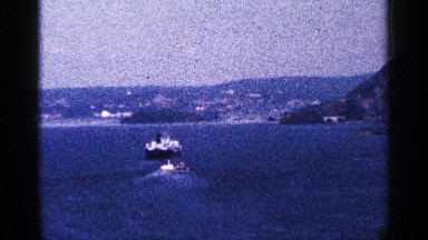 1964: yacht pulling two small boats in the lake. NIAGRA FALLS CANADA