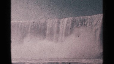 1964: cascading waterfall, rushing down to its foamy white lagoon NIAGRA FALLS