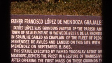 1966: a brown sign stands in front of a state of a pastor of st. augustine