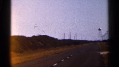 1966: Shaky Footage of Open Road with Water Tower in Background FLORIDA
