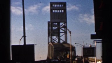 1966: a big building near to bridge go to road car heavy low angle view