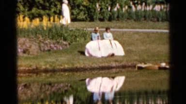1966: a pair of friends working at the park on a beautiful and shining day