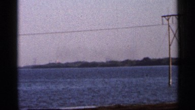 1966: flooded countryside with electric pole lines and village FLORIDA